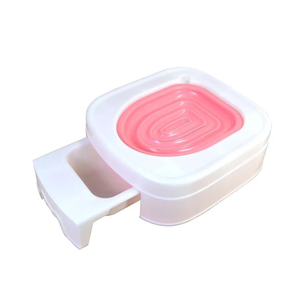 Weißer Katzen-Toilettentraining-Kit mit rosa, geformtem Kunststoff-Sitz und Basis.