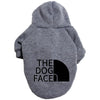A gray cozy fleece pet hoodie with a hood featuring the text THE DOG FACED.