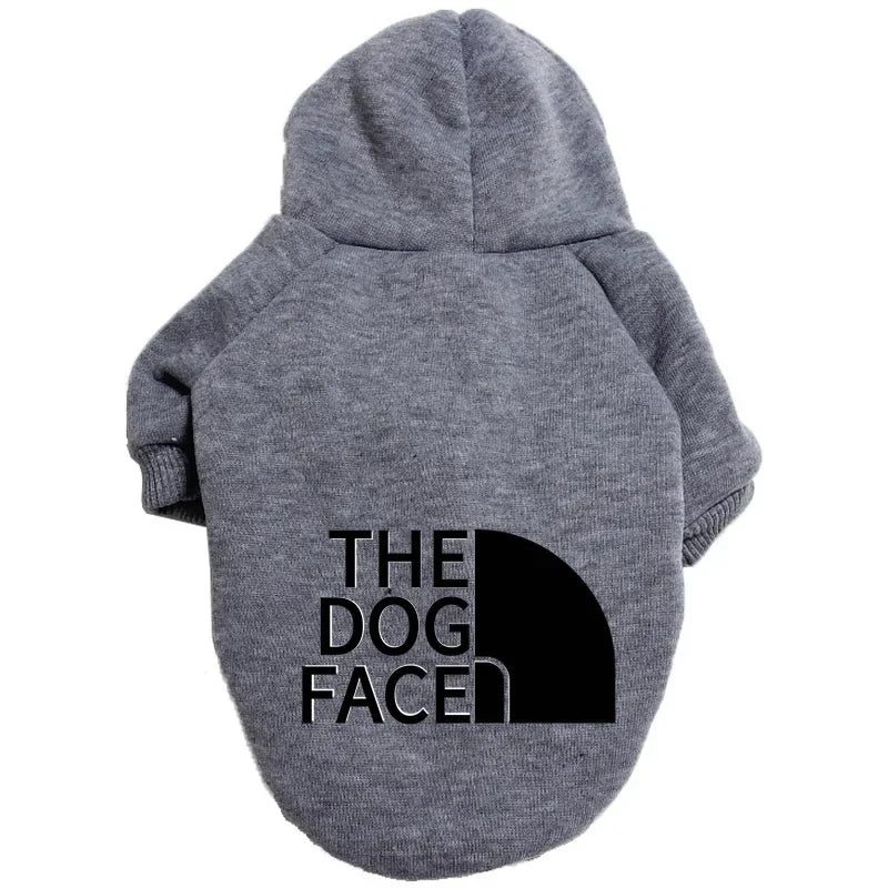 A gray cozy fleece pet hoodie with a hood featuring the text THE DOG FACED.