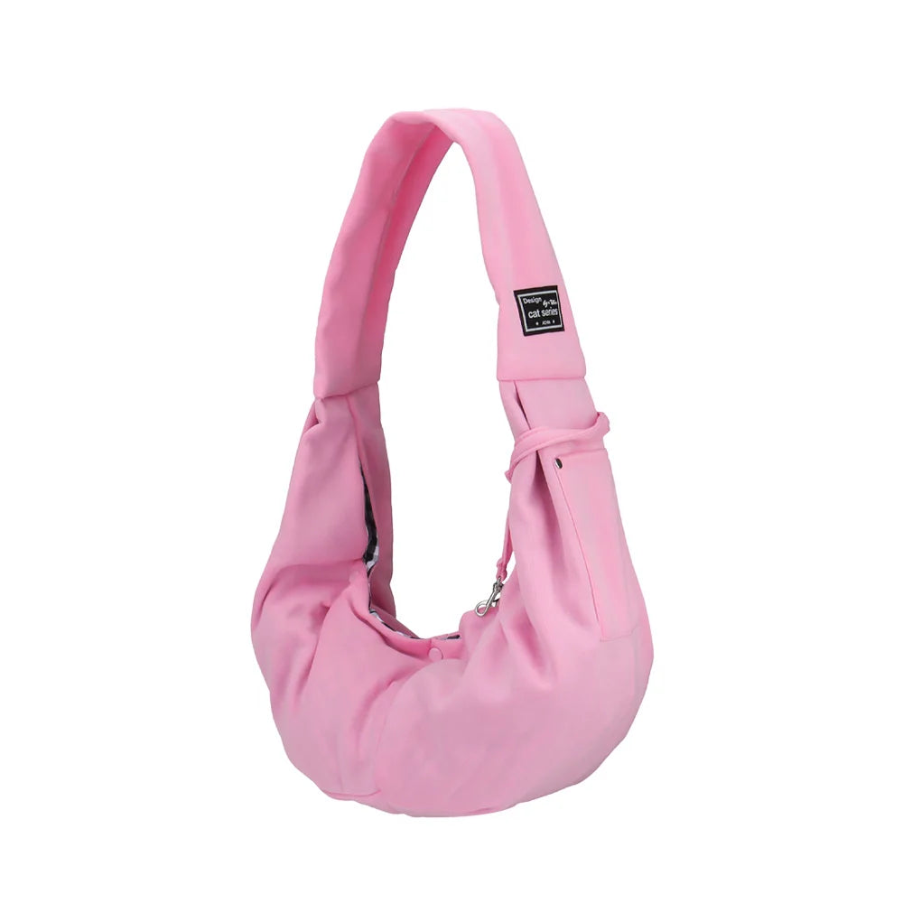 Pinkes tragbares Hundetransport-Rucksack mit Riemen und kleinem Anhänger.