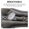 Close-up of a dark mesh pet harness showing its breathable texture and fit against a body.