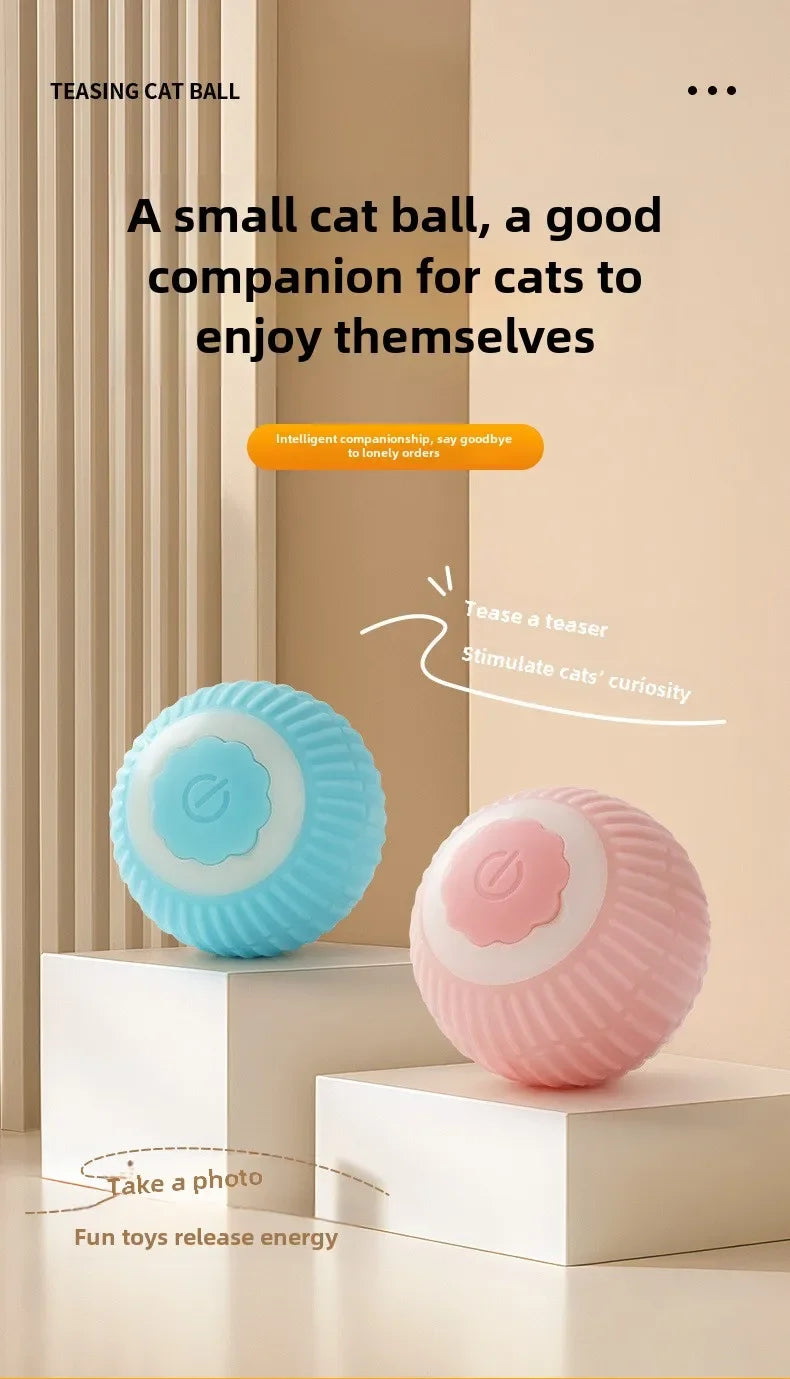 A small, light blue and pink textured cat ball toy displayed on white pedestals.