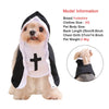 A Yorkshire dog wearing a black and white nun costume with a cross on the chest