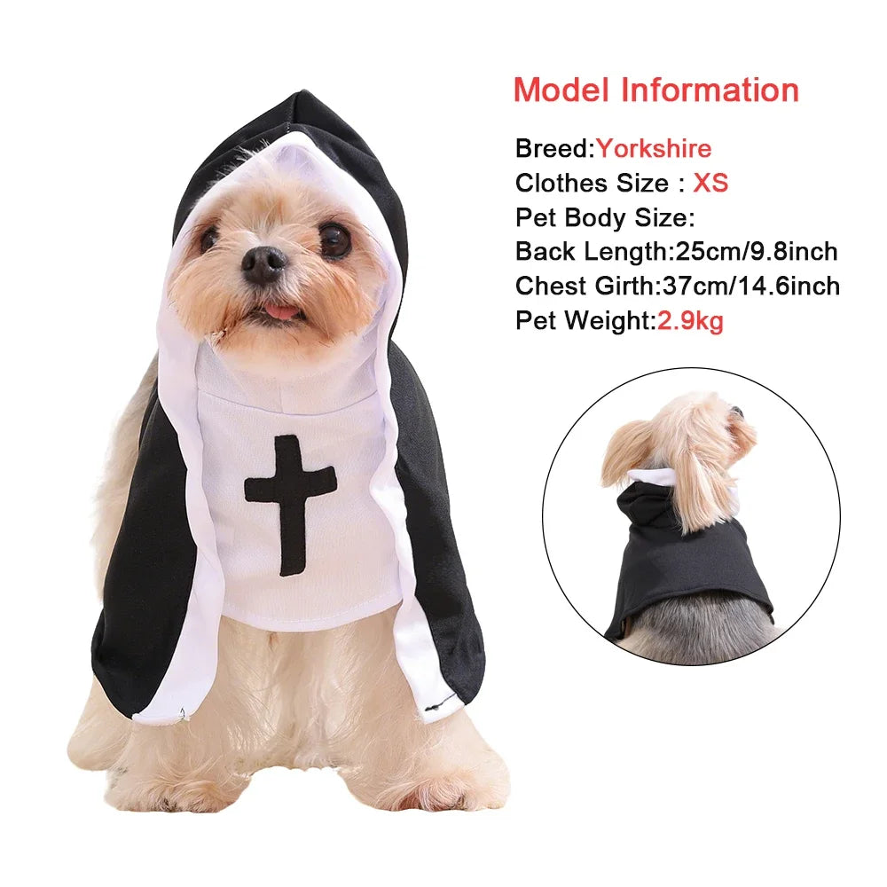 A Yorkshire dog wearing a black and white nun costume with a cross on the chest