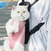 A white cat is sitting inside a black breathable pet carrier backpack being carried by a person.