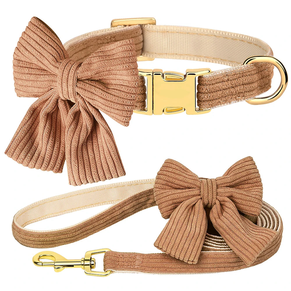 A tan velvet dog collar and leash set featuring a large bowknot.