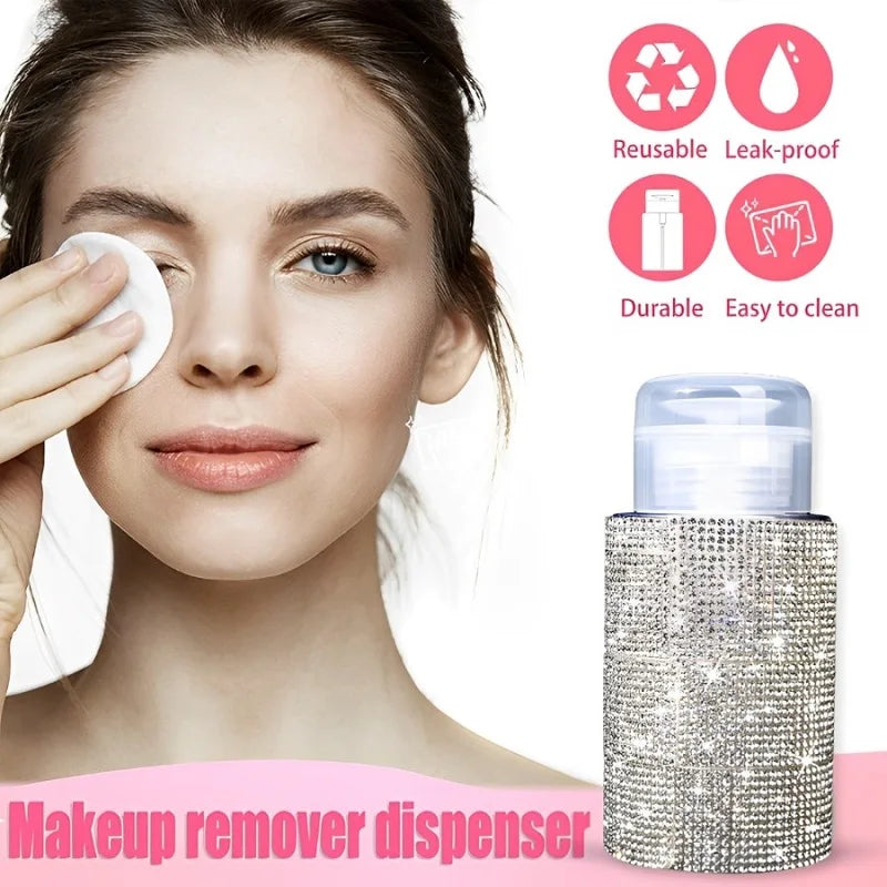 A cosmetic makeup remover dispenser bottle with a diamond-textured silver body and clear pump top, shown next to a woman appl