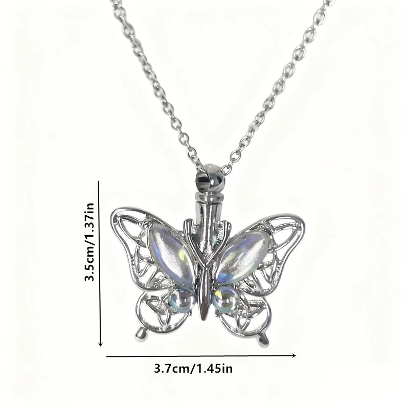 Silver butterfly ashes urn necklace with a detailed, open-winged design