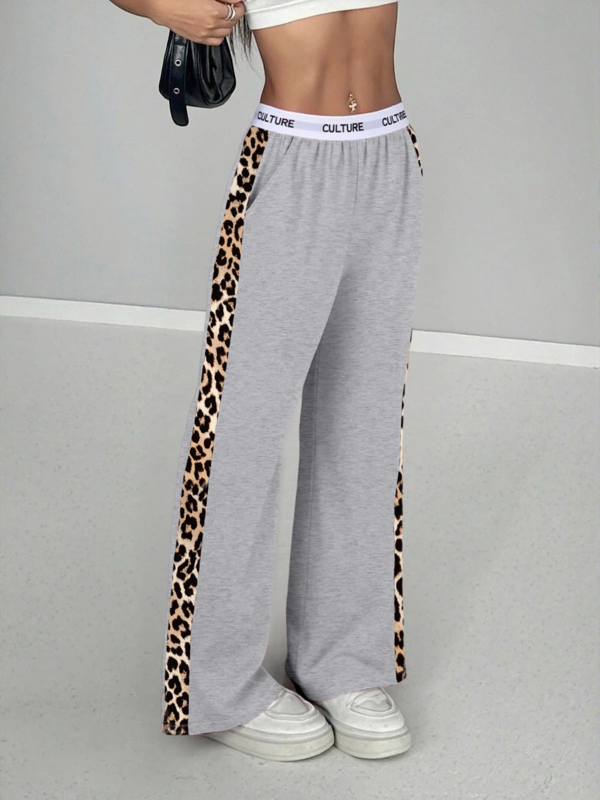 Gray high-waist wide leg pants with a leopard print side stripe and a white band top