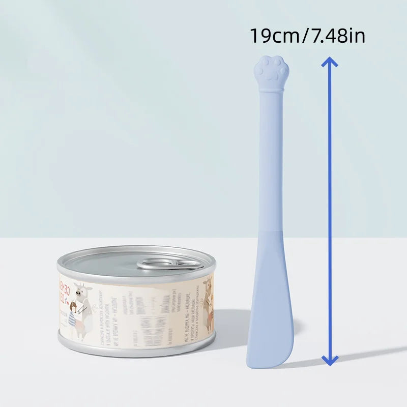 A light blue multi-purpose pet feeding spoon with a built-in can opener and seal cap, shown next to its size measurement.