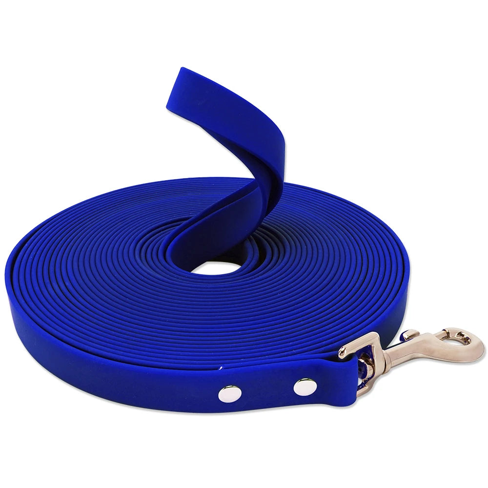 A coiled royal blue heavy-duty waterproof dog leash with a buckle attached.