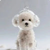 A clear, fluffy white dog-shaped keychain made of pet hair.