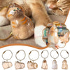A collection of small cat fur memorial charms and keychains in various colors and styles.