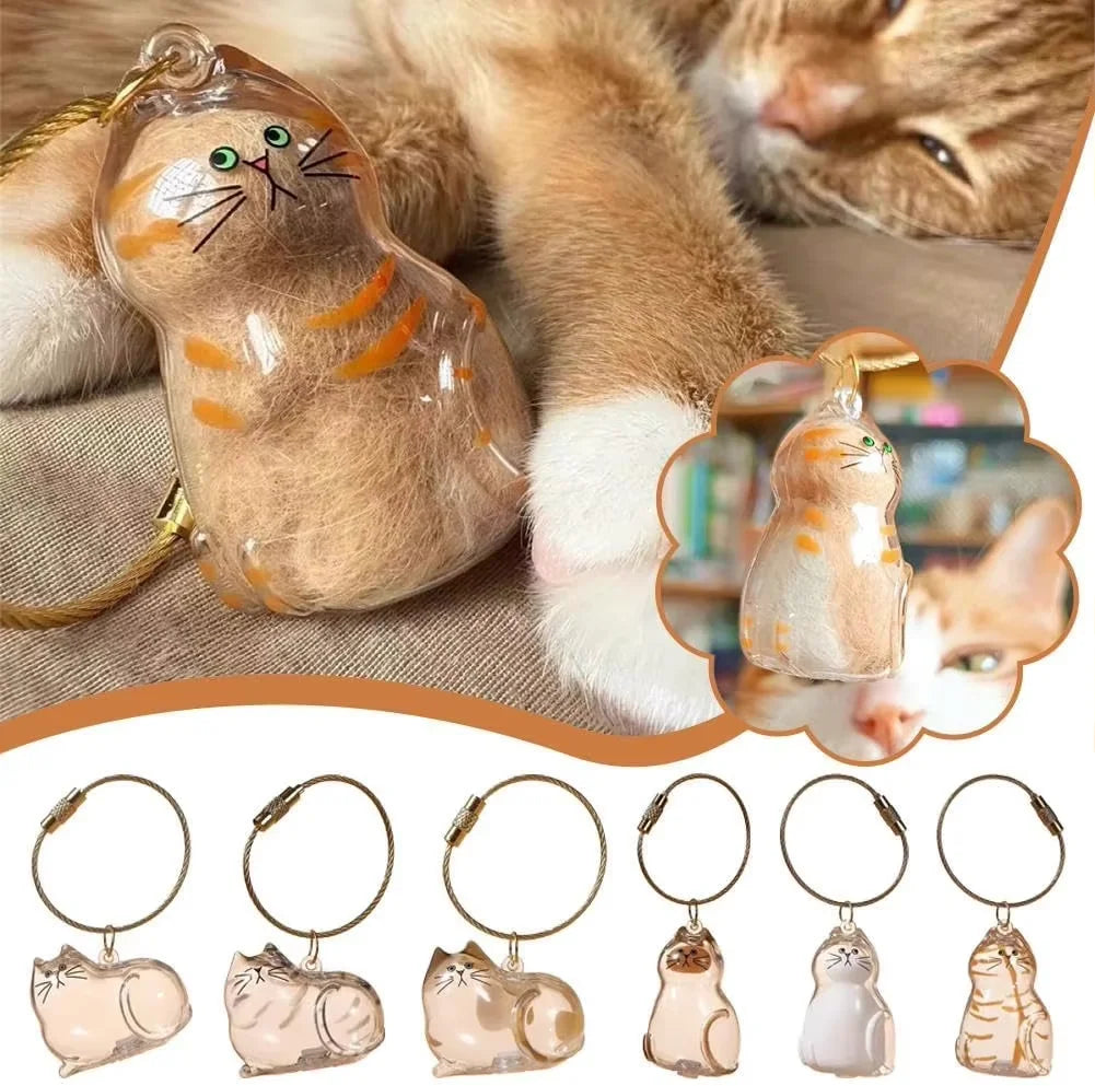 A collection of small cat fur memorial charms and keychains in various colors and styles.