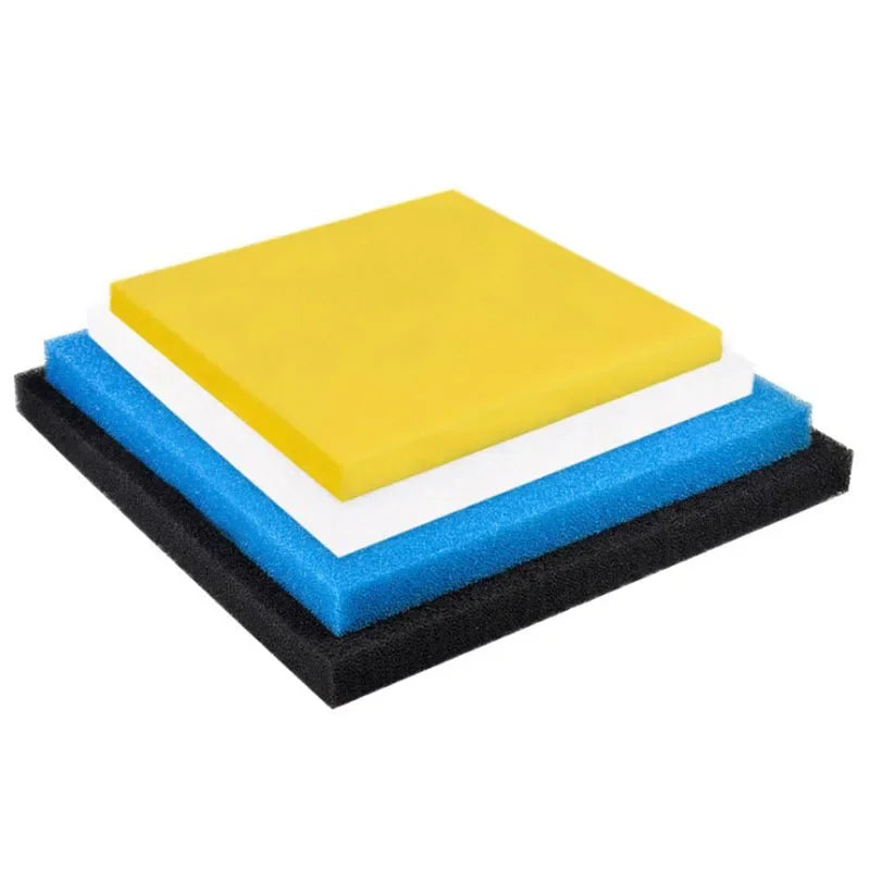 A stack of yellow, white, and blue foam filters used for aquarium biochemical filtration.