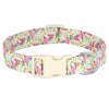A beige nylon dog collar featuring a vibrant print of bees and flowers.