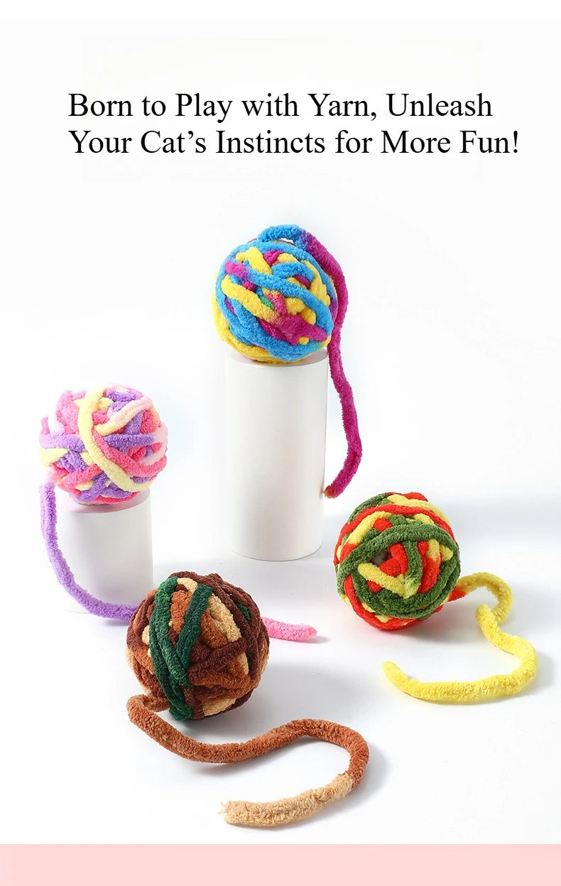 A colorful yarn ball toy for cats is shown next to a white container and a yellow string.