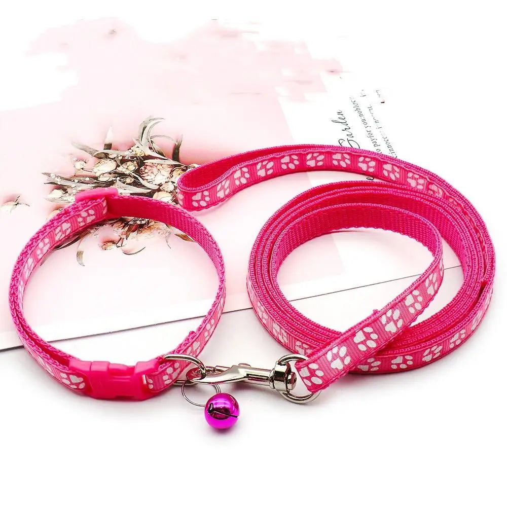 Pink breathable pet walking lead with an adjustable collar and a purple charm