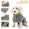 A gray dog bath towel with an adjustable collar and chest velcro, shown on a white dog.
