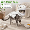 A gray tabby cat wearing a white dinosaur skeleton pet costume with a soft plush feel.