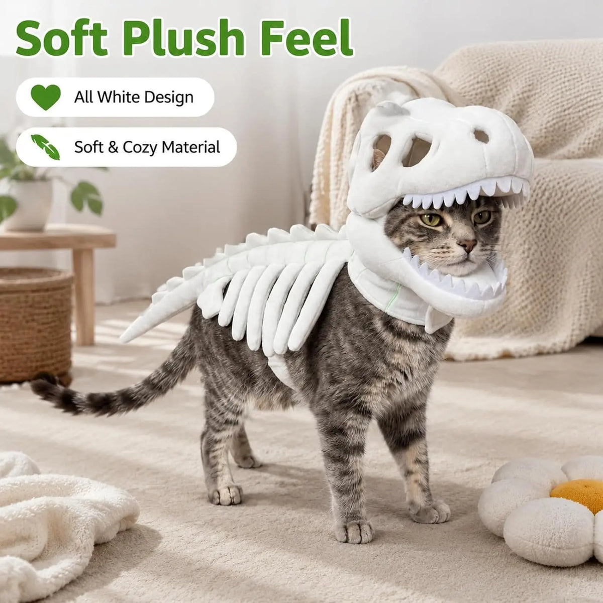 A gray tabby cat wearing a white dinosaur skeleton pet costume with a soft plush feel.