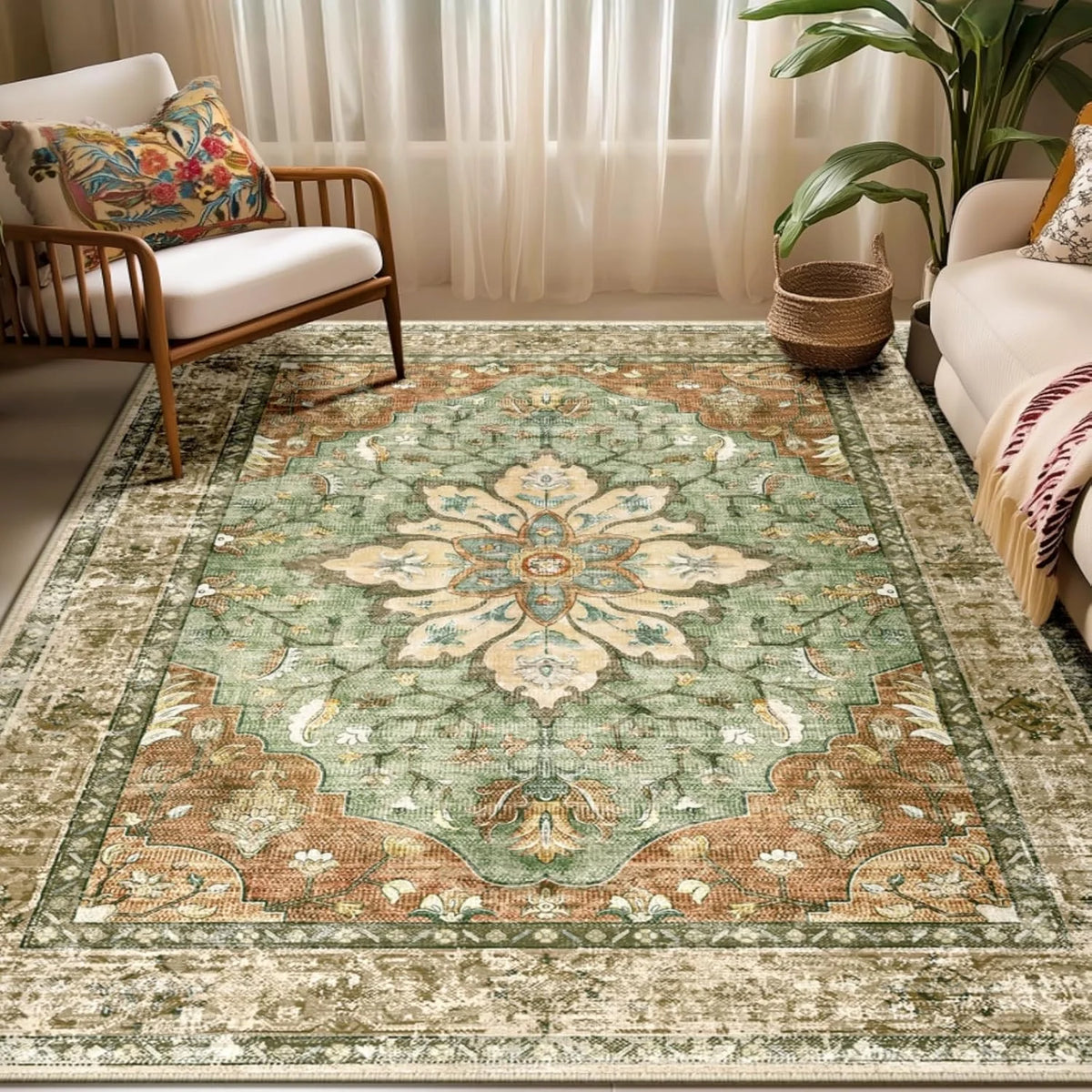 A detailed bohemian Persian floral area rug with muted green and beige tones in a living room setting.