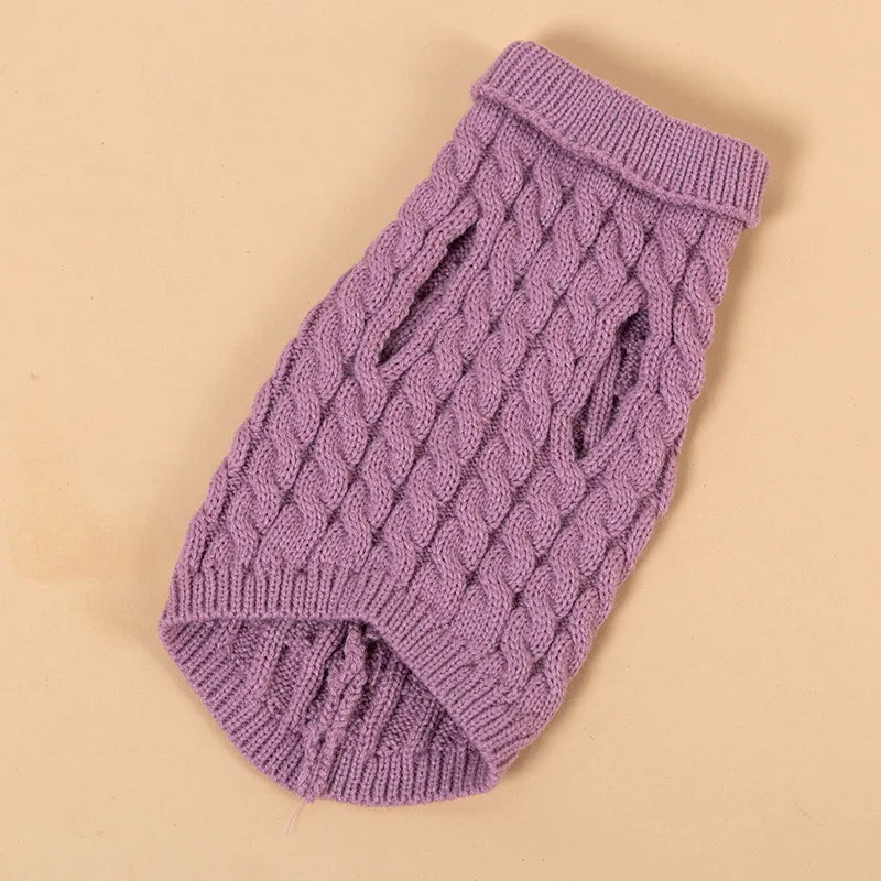 A purple knitted turtleneck sweater for a dog, shown flat lay on a light background.