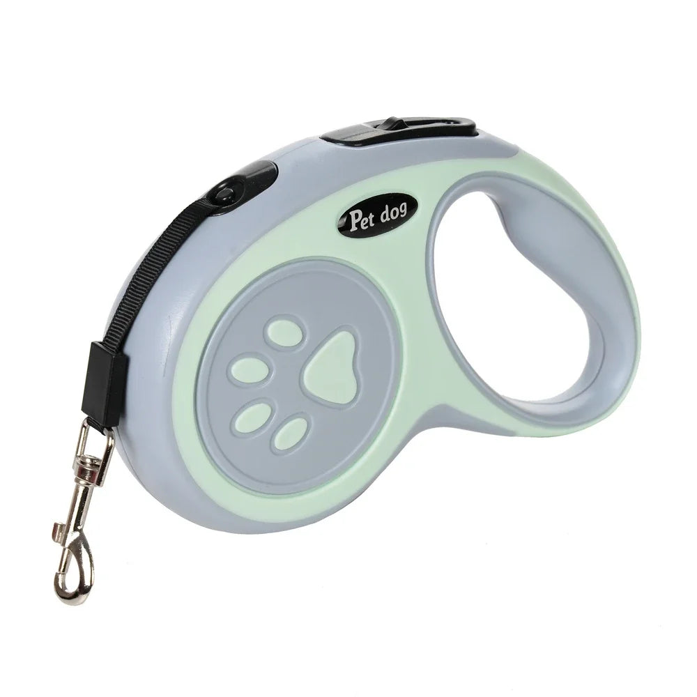 Correa retráctil de nylon gris claro para mascotas con acento verde y asa, con diseño de huella de pata.