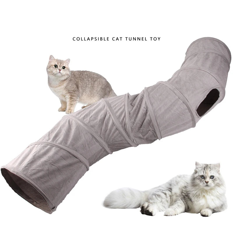 A gray collapsible cat tunnel toy is shown with a kitten and a cat lying next to it.