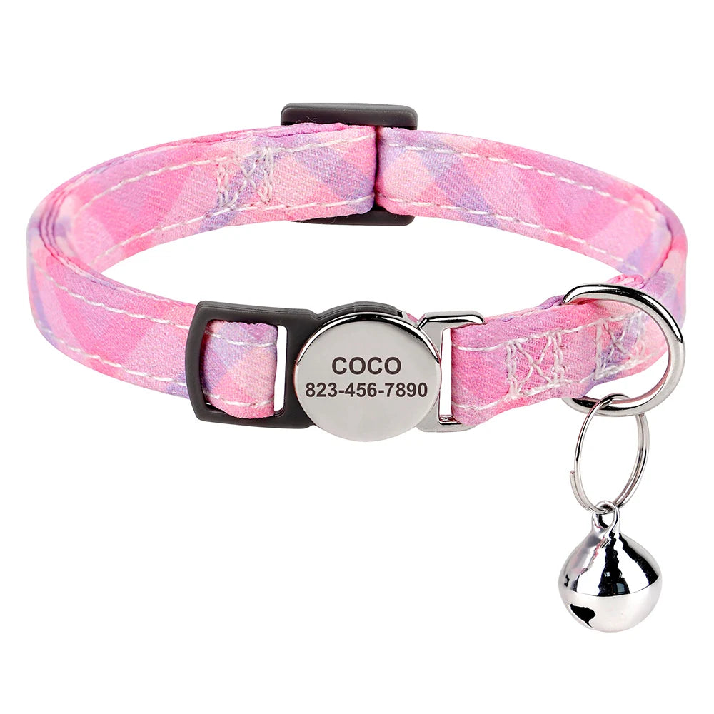 Pink plaid cat collar with a black buckle and silver engraved ID tag.