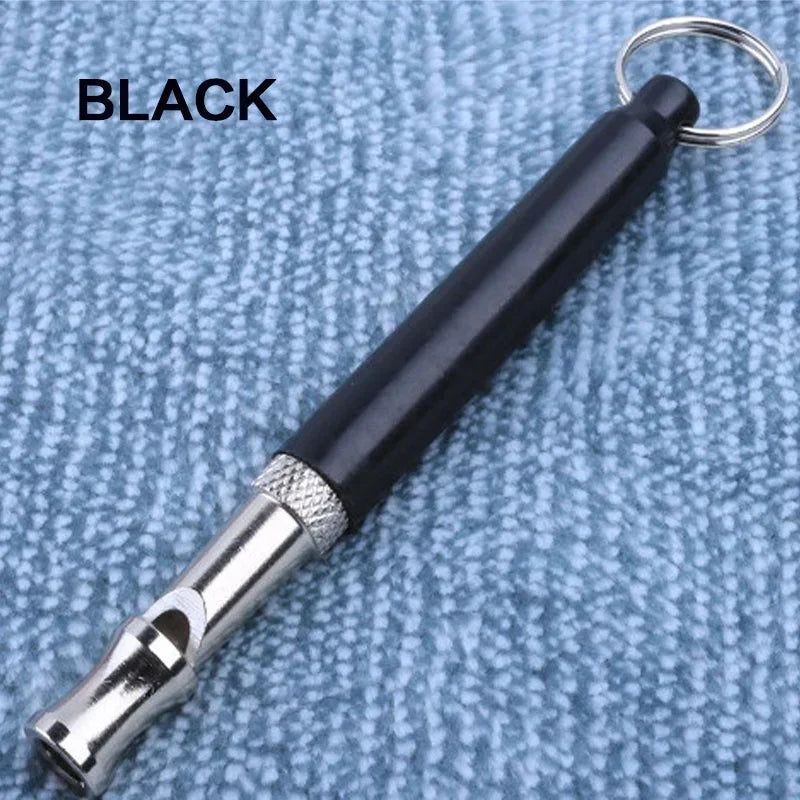 Black ultrasonic dog training whistle with a silver tip and metal keyring attached
