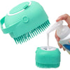 A hand is holding a teal silicone pet shampoo brush and grooming comb with teeth visible.