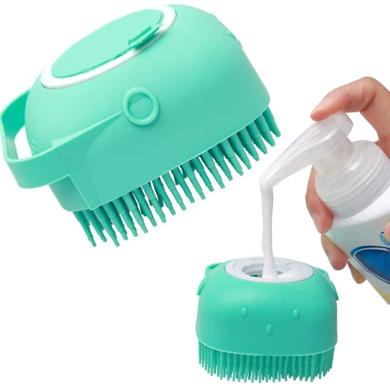 A hand is holding a teal silicone pet shampoo brush and grooming comb with teeth visible.