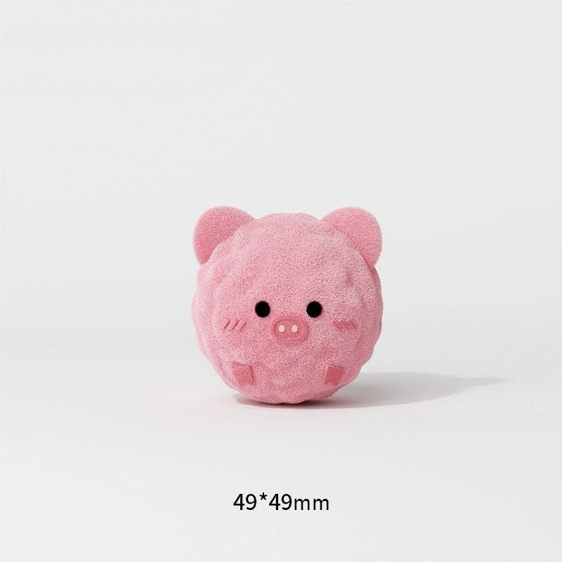 A pink, fluffy pig-shaped squeaky ball dog chew toy for teeth cleaning and interactive play.