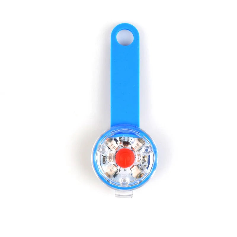 Blue rechargeable LED dog collar light with a loop and a circular light component.