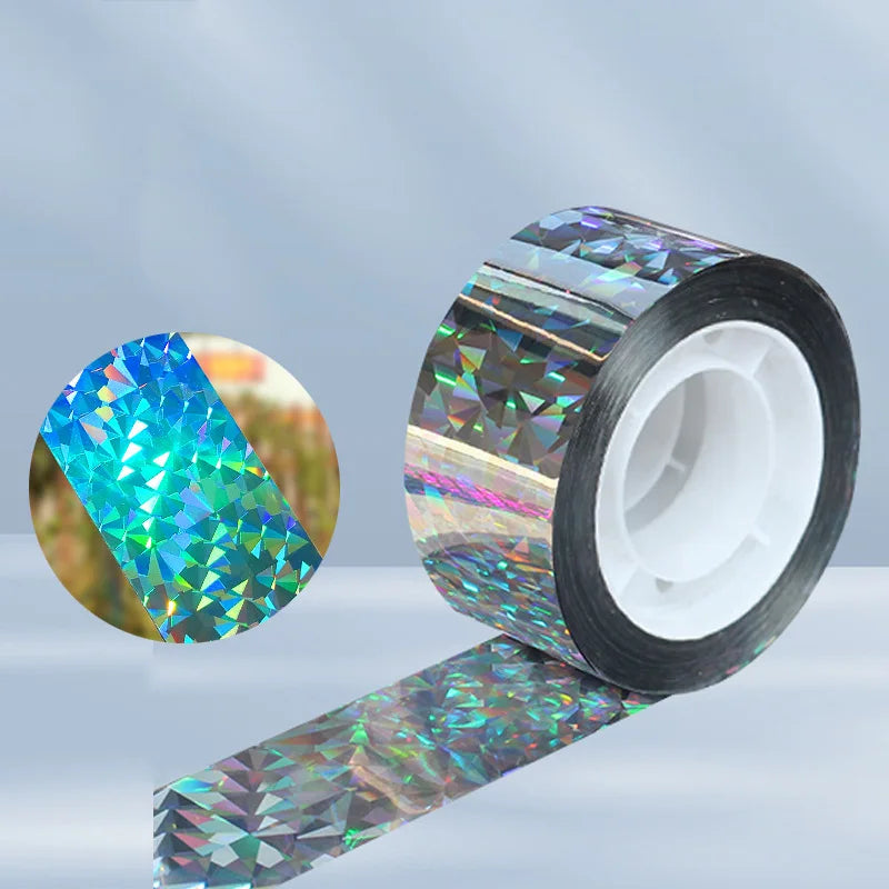 Roll of reflective bird deterrent tape showing iridescent colors and a strip of the tape.