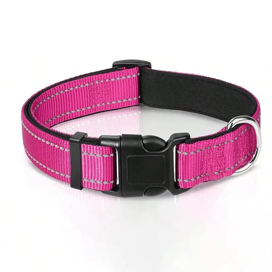 A pink and black padded dog collar with reflective safety stripes.