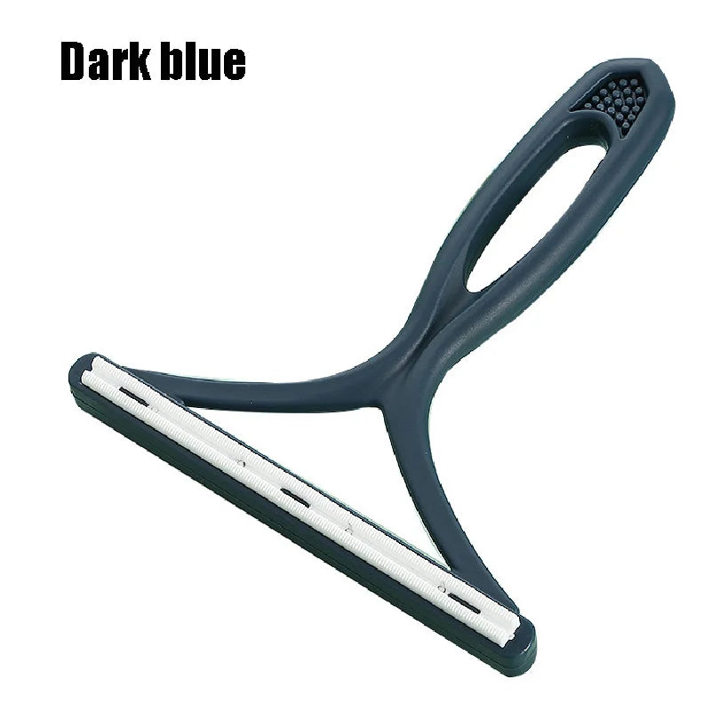 A dark blue portable fabric and pet hair remover brush with a flexible handle and a flat cleaning strip.