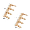 شجرة قطط خشبية معلقة على الحائط بأغصان متعددة للتسلق