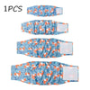 Un juego de cuatro pañales o protectores abdominales lavables para perros con estampado floral azul y naranja.