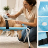 A woman is gently grooming a dog on a blue foldable pet grooming hammock designed for comfort and safety.