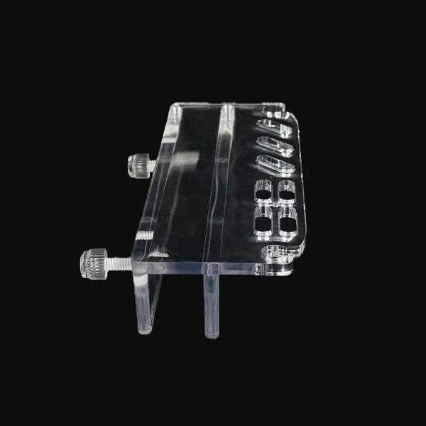Clear acrylic tool organizer with multiple slots and a handle for aquarium maintenance tools.