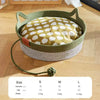 Handwoven rattan cat bed with a green rope edge and a beige cotton interior.