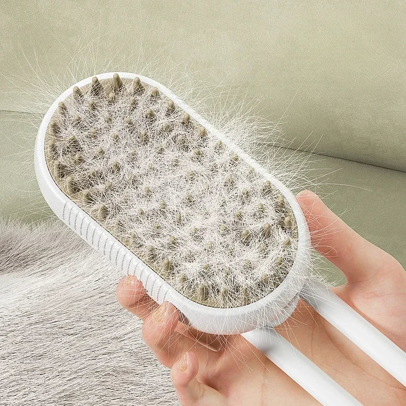 A hand holds a white pet grooming brush with a dense, bristled head against a light green background.