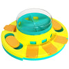 A yellow and teal interactive dog slow feeder puzzle toy with orange feeding compartments.