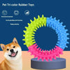 A tricolor rubber ring toy for dogs with teeth grinding and cleaning features shown next to a chihuahua.
