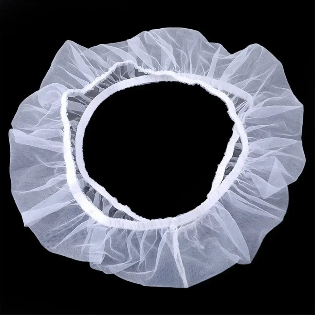 A white bird cage seed catcher net with a ruffled, circular design.