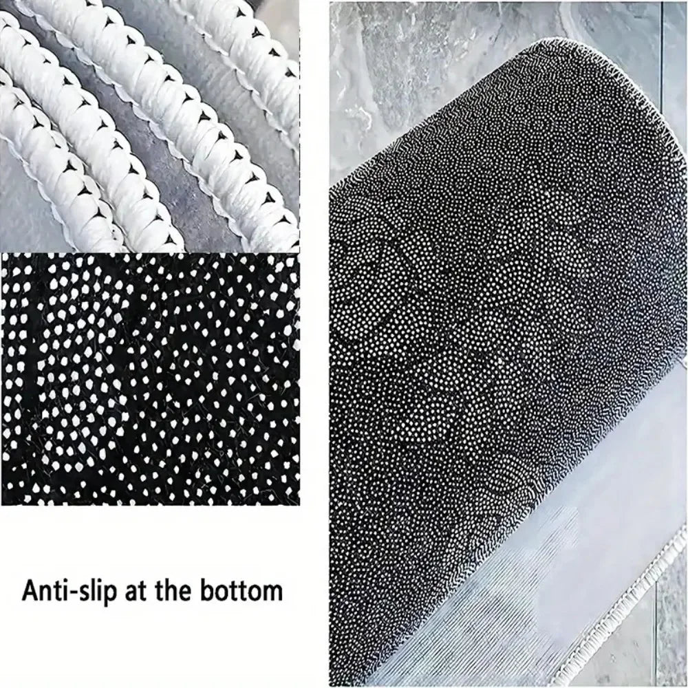 Close-up view of a black and white anti-slip area rug with a floral pattern on the top surface.