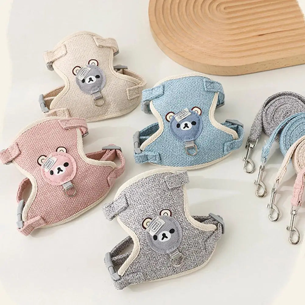 A collection of light-colored pet leash harnesses for dogs and cats featuring cute bear designs.