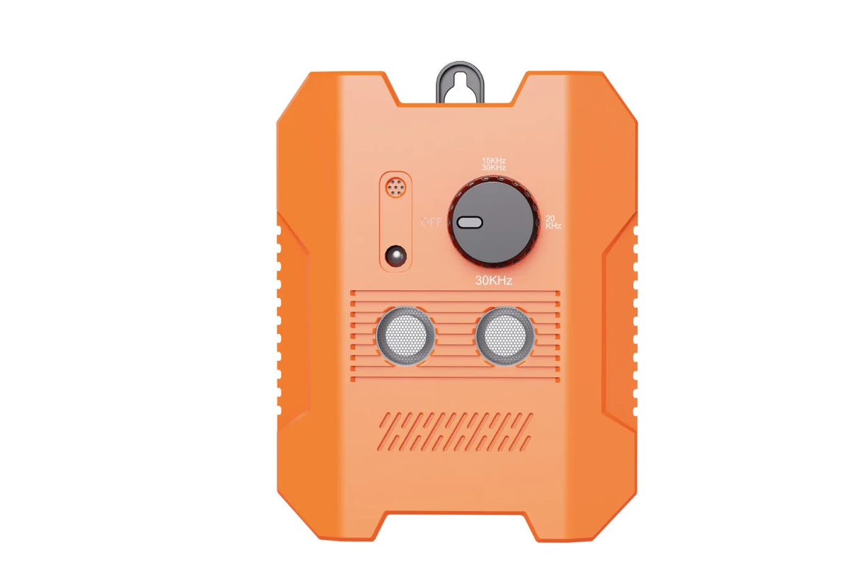 An orange rechargeable ultrasonic dog bark deterrent device with a round switch and two speaker grills.